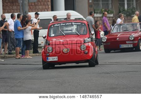 BELGRADE,SERBIA - SEPTEMBER 10, 2016:Old Fiat 500 at the commercial race of old cars in memory of formula 1 race held on the same place in 1939 two days after the beginning of Second World Warwhen the famous Italian driver Tazio Nuvolari won