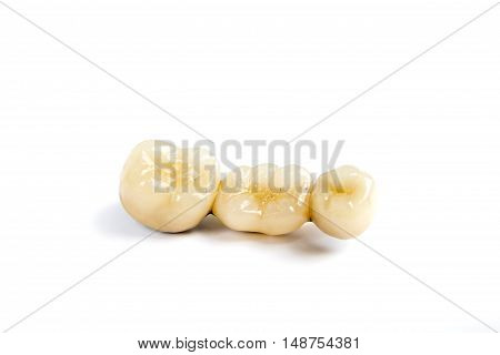 Dental ceramic tooth crowns on white background. Isolated.