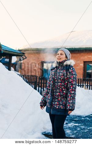 beautiful girl winter outdoors looking into distance