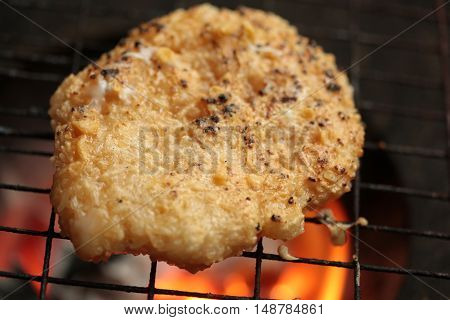 sticky rice with egg grilled Asian traditional food (Kgawhie) at street food in Thailand.