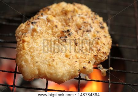 sticky rice with egg grilled Asian traditional food (Kgawhie) at street food in Thailand.