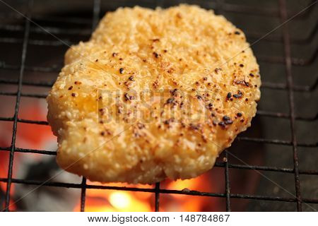 sticky rice with egg grilled Asian traditional food (Kgawhie) at street food in Thailand.
