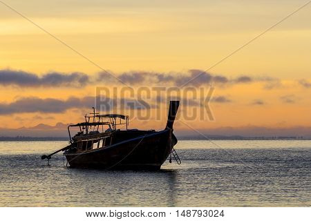 Boats wait for the tourists departing on the sunrise in the morning at railay krabi Thailand.