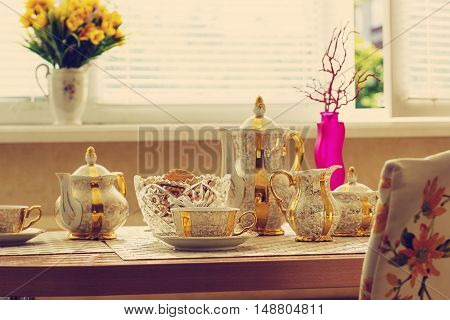 Fresh breakfast with hot tea in morning sunlight