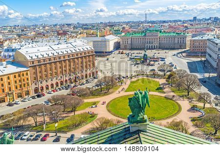The rooftop of St Isaac's Cathedral is the best place to enjoy the ensemble of St Isaac's Square with green park monument of Tsar Nicholas I Mariinsky Palace historic hotels and mansions St Petersburg Russia.