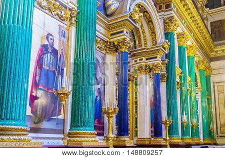 SAINT PETERSBURG RUSSIA - APRIL 25 2015: The green malachite and blue lazurite columns decorate iconostasis of St Isaac's Cathedral on April 25 in Saint Petersburg.