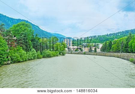 The wide Kura River flows along the center of Borjomi resort Georgia.