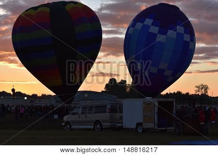 QUEENSBURY, NY - SEP 24: Balloon launch at dawn at the 2016 Adirondack Hot Air Balloon Festival held from Sep 22-25. Thousands of people attended the festival which is the largest of its kind on the East coast.
