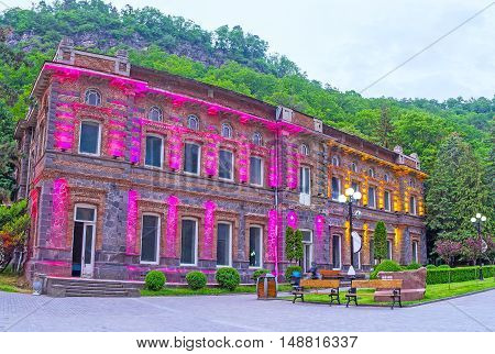 The brightly illuminated mansion in Mineral Water Park of Borjomi Georgia.