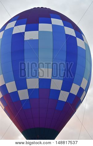 QUEENSBURY, NY - SEP 24: Balloon launch at dawn at the 2016 Adirondack Hot Air Balloon Festival held from Sep 22-25. Thousands of people attended the festival which is the largest of its kind on the East coast.