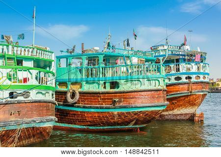 Dubai, United Arab Emirates - May 3, 2013: close up of traditional wooden boat docked on Bay Creek. The creek is divides the city into two main sections Deira and Bur Dubai old downtown of Dubai.