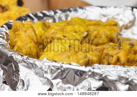 Vegetables fried rolls in batter also called Mshat Zahra. Large bowl covered with foil