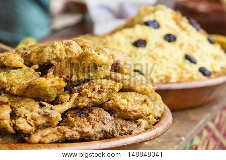 Vegetables fried rolls in batter also called Mshat Zahra and couscous. Moroccan recipes