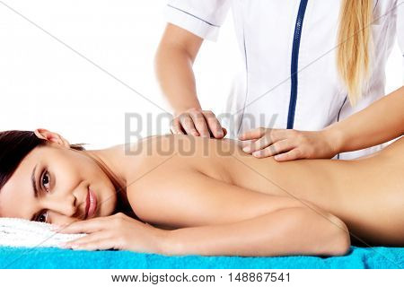 Woman having massage of body in the spa salon. Beauty treatment concept.