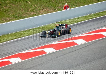 The racing car leaves lock-up garage during The Formula 1 Grand Prix at autodrome 