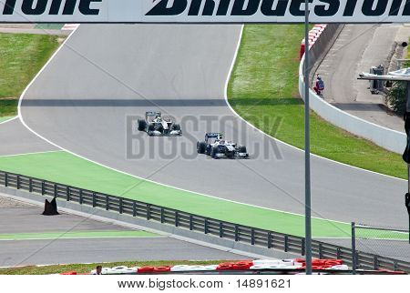Racing cars on a circuit during The Formula 1 Grand Prix at autodrome 