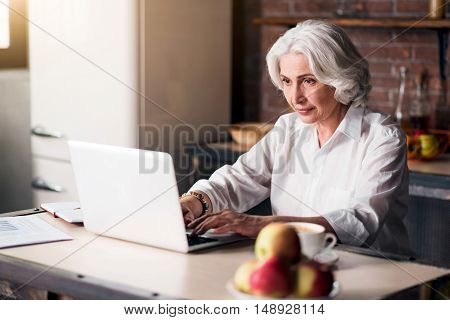 You got mail Granny writing message to her grandchildren through the Internet