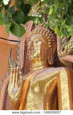 Gold Buddha statue (Luang por shin pa tan porn) in Thailand temple at Kanchanaburi temple (Wat Tham Sua).