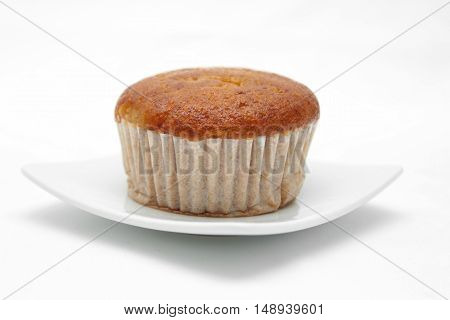 Banana cupcake with chololate on white plate
