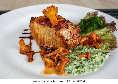 Fillet of beef or pork steak with mushrooms and sauce with chanterelles