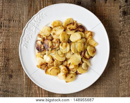close up of rustic german bratkartofflen fried potatoes