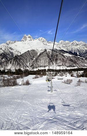 Chair-lift and Mount Ushba in sun day. Caucasus Mountains. Hatsvali Svaneti region of Georgia.