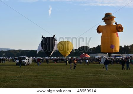 QUEENSBURY, NY - SEP 24: Balloon launch at dawn at the 2016 Adirondack Hot Air Balloon Festival held from Sep 22-25. Thousands of people attended the festival which is the largest of its kind on the East coast.