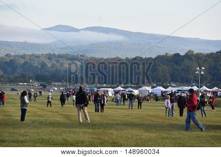 QUEENSBURY, NY - SEP 24: Balloon launch at dawn at the 2016 Adirondack Hot Air Balloon Festival held from Sep 22-25. Thousands of people attended the festival which is the largest of its kind on the East coast.
