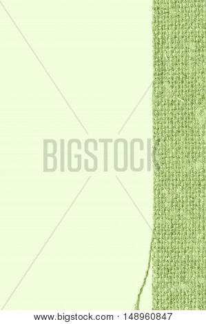 Textile tissue fabric patch green canvas crisscross material closeup background