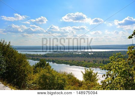 Panoramic view from the hill on the the Volga river near Samara city at sunny day. Beautiful natural landscape. Russia.
