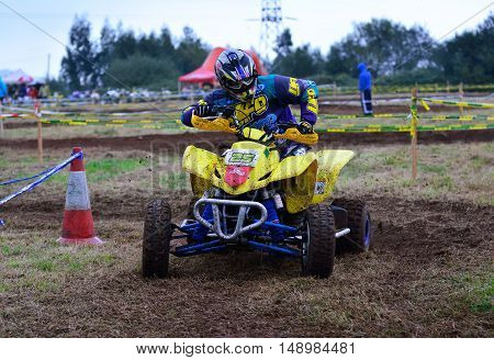 Unidentified Racer Rides A Quad Motorbike.