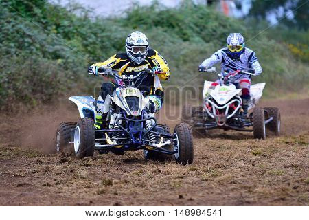 Unidentified Racer Rides A Quad Motorbike.