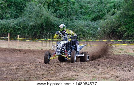 Unidentified Racer Rides A Quad Motorbike.