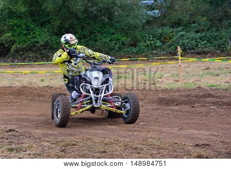 Unidentified Racer Rides A Quad Motorbike.