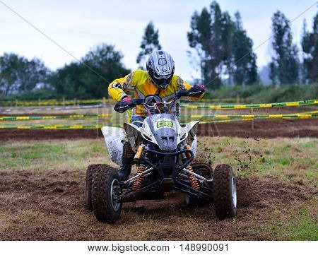 Unidentified Racer Rides A Quad Motorbike.