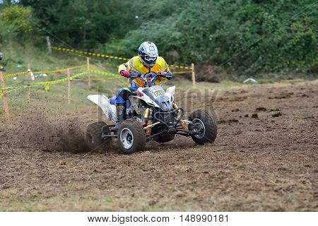 Unidentified Racer Rides A Quad Motorbike.