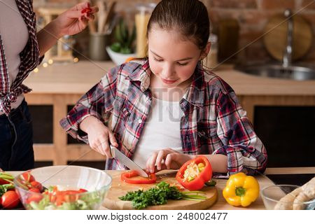 Moms Little Helper. Kid Girl Preparing Salad For Dinner. Happy Family Cooking Leisure And Good Paren