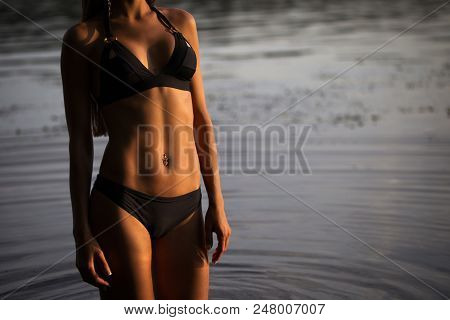 Side View Of Back Light Of A Woman Silhouette Breathing Deep Fresh Air At Warm Sunrise In Front Of S