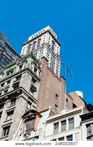 New York City, Usa - June 20, 2018: Low Angle View Of Old Buildings Against Sky In Midtown Of Manhat