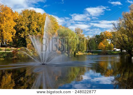 Valmiera. Latvia. City Autumn Landscape With A Pond And Fountain.