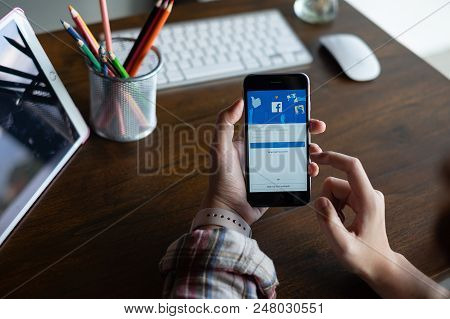 Chiang Mai ,thailand July 04 2018 : Man Holding A Iphone 6S With Social Internet Service Facebook On