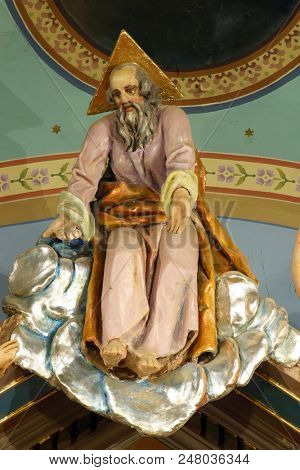 ZACRETJE, CROATIA - AUGUST 06: God the Father, statue on the main altar in the Parish Church of the Holy Cross in Zacretje, Croatia on August 06, 2017.