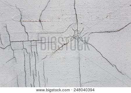 Texture Of White Dirty Cracked Wall. Small Straight Cracks. Direct Fracture On Painted Surface. Cell