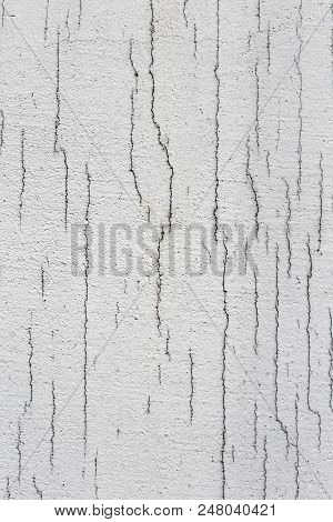 Texture Of White Dirty Cracked Wall. Small Straight Cracks. Direct Fracture On Painted Surface. Cell