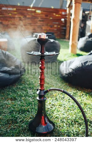 Hookah Black On The Street. Hookah On The Grass. Background Lifestyle Concept . Background Black Pou