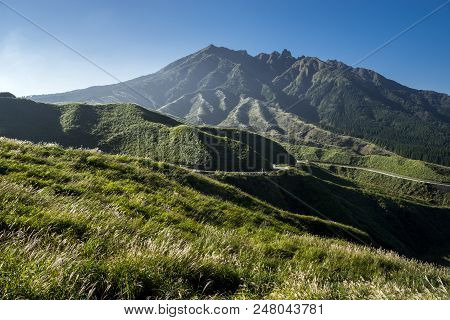 Mount Nekodake Of Aso Mountain Range Under Blue Sky In Kumamoto