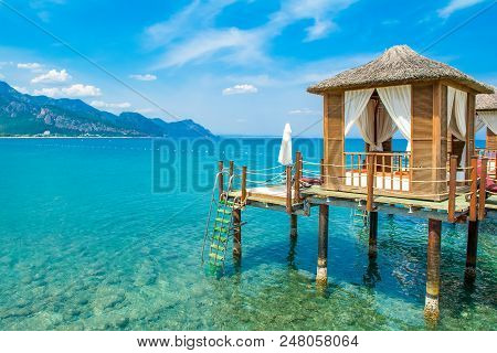 Wooden Beach Pavilions On The Shore Of A Sandy Beach - The Mediterranean Coast, Beldibi, Antalya, Tu