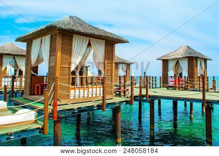 Wooden Beach Pavilions On The Shore Of A Sandy Beach - The Mediterranean Coast, Beldibi, Antalya, Tu