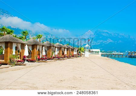 Wooden Beach Pavilions On The Shore Of A Sandy Beach - The Mediterranean Coast, Beldibi, Antalya, Tu