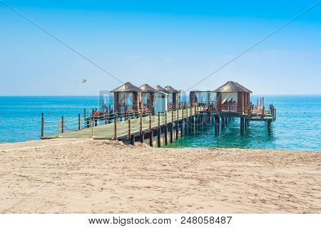 Wooden Beach Pavilions On The Shore Of A Sandy Beach - The Mediterranean Coast, Beldibi, Antalya, Tu